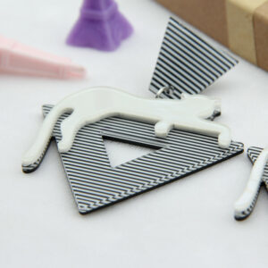 Christi Tasker Miami Walk The Straight & Narrow | Acrylic Cat on Stripes Earrings 3e63eb3f-70f9-559a-862e-e77d179e45d6.jpg Fine stripes on an open triangle with a white tiger lounging on top, Walk The Straight Line earrings are a compliment waiting to happen. Make a statement and wear these black and white earrings with almost anything. The stripes are illusional and detailed. Add these to your cart before they pounce. Acrylic Cat on Stripes Earrings,Stripes Earrings,Fashion earrings