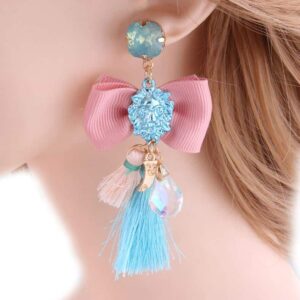 Christi Tasker Miami Passementarie Bow Tie Lion's Head Medallion Tassel Earrings (Rose Pink Bow w/ Light Blue Tassel & Blue Lion) 731087cd-9201-5c6f-80e8-265850a1ae5d.jpg Each bow is delicately tied with a lions head and dangling tassels, stones, & threads. Each pair may be slightly different so you'll find multiple color and style listings for this same design. Bow Tie Lion's