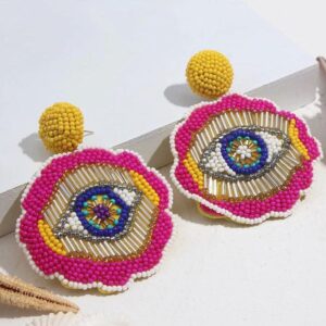 Christi Tasker Miami All Eyes On You | Hand Beaded Eye Earrings febd9c90-4a9e-5434-9ebd-9a0a702208bf.jpg All Eyes On You are luxurious pair of hand beaded earrings featuring blue & brown eyes in the center of each earring surrounded by silver, yellow, and hot pink beads. The backs are felted to keep them lightweight and wearable all day. Hand Beaded Eye Earrings